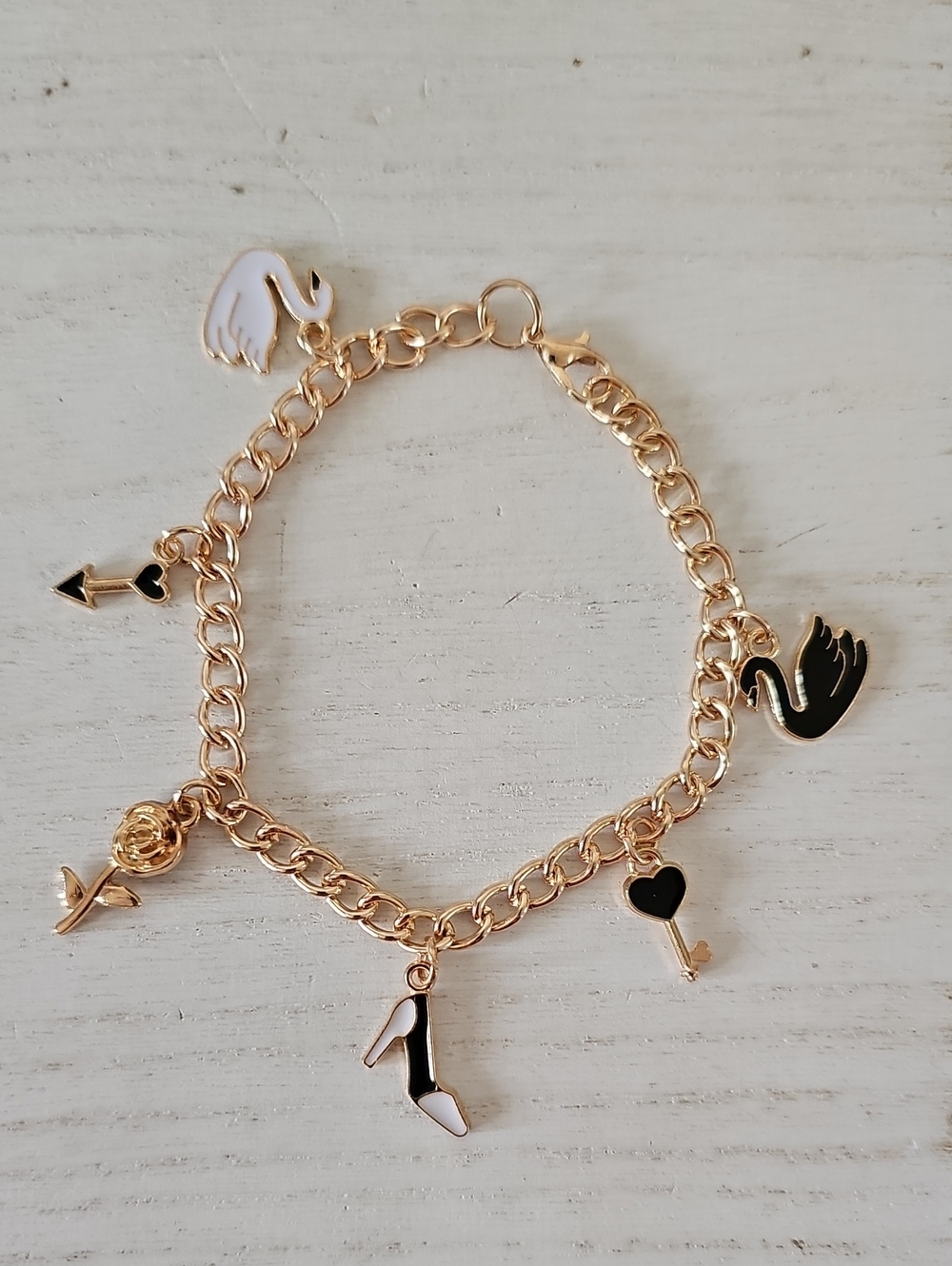 Gold Tone Charm Bracelet with Black & White Enamel Charms